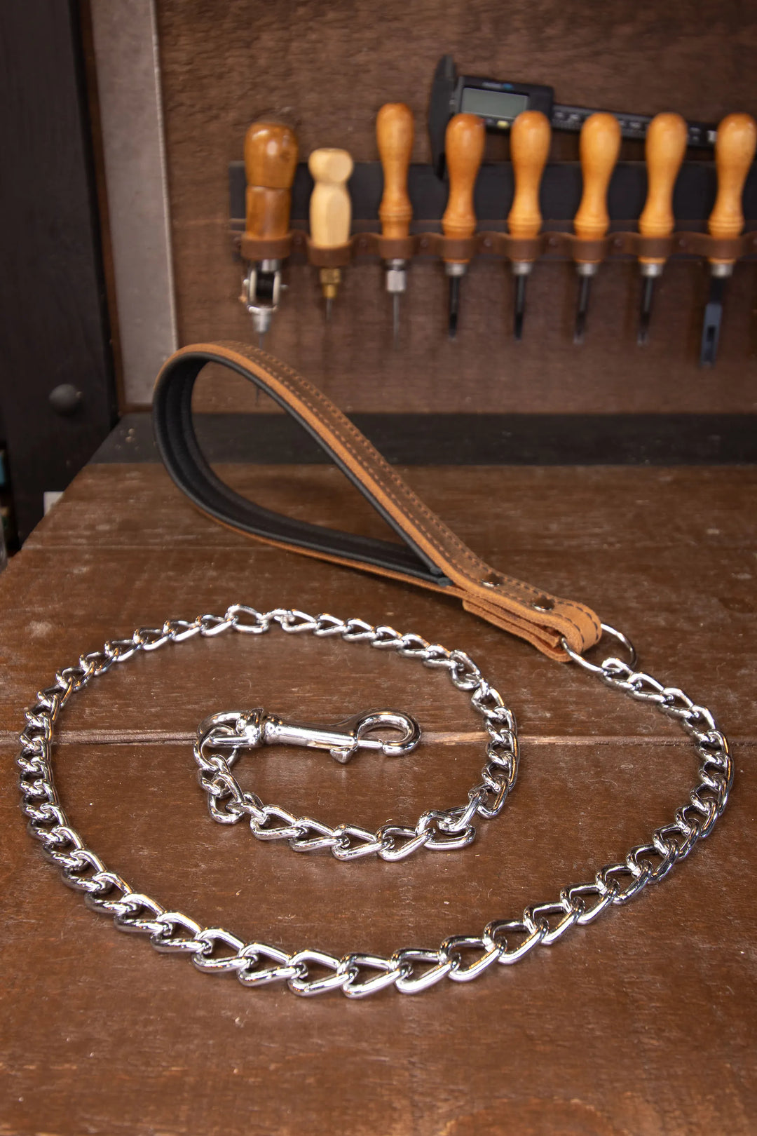 Leather Leash with chain on a workshop table