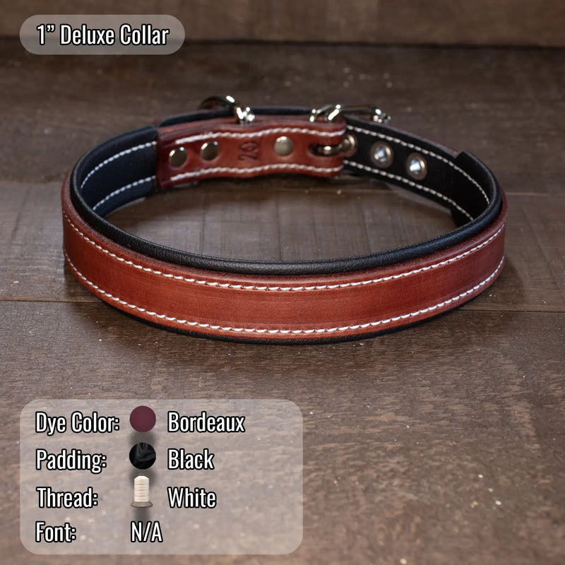 A 1-inch deluxe collar made of Bordeaux brown leather with black padding, white stitching, and silver metal hardware, displayed on a dark wooden surface. A text overlay at the bottom left details the color and material specifications.