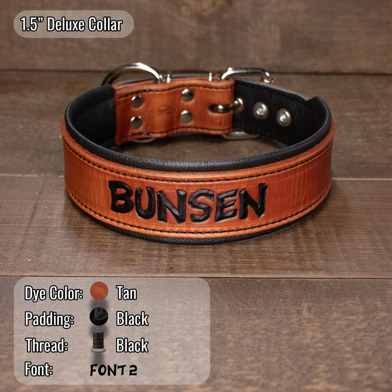 A tan leather dog collar with black padded interior and black hand tooled text reading 'BUNSEN' on the front, shown on a brown wood plank background. A small overlay at top left says '1.