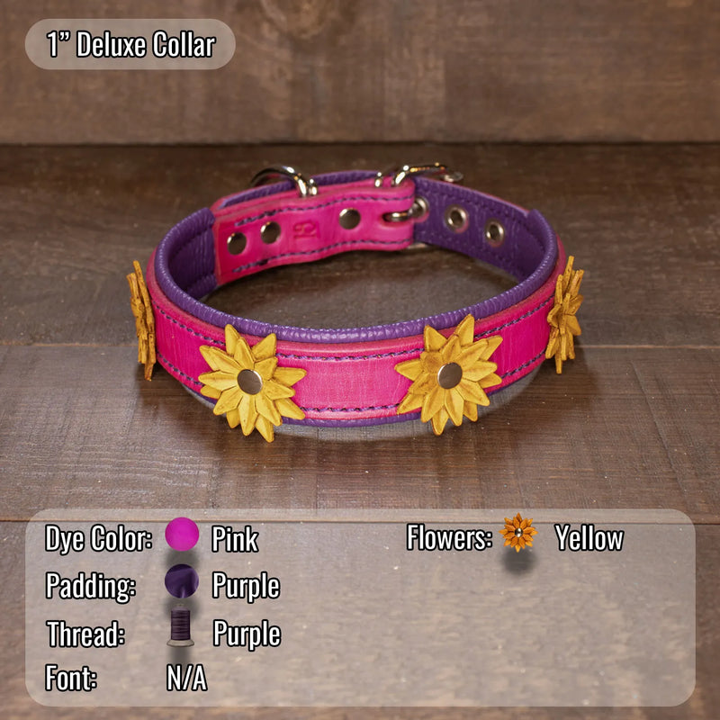 A 1" Deluxe Collar dog collar made of pink and purple leather with yellow flower appliqués, displayed on a dark wood background with a color specification overlay at the bottom.