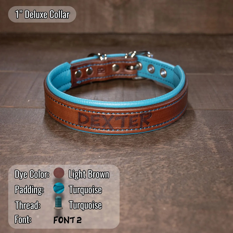 Light brown dog collar with turquoise thread and padding with dogs name "dexter" etched onto it.