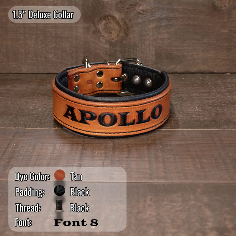 A tan leather dog collar with black padding and the name 'APOLLO' printed in black across the front, displayed on a rustic wooden surface. An overlay at the top left reads '1.