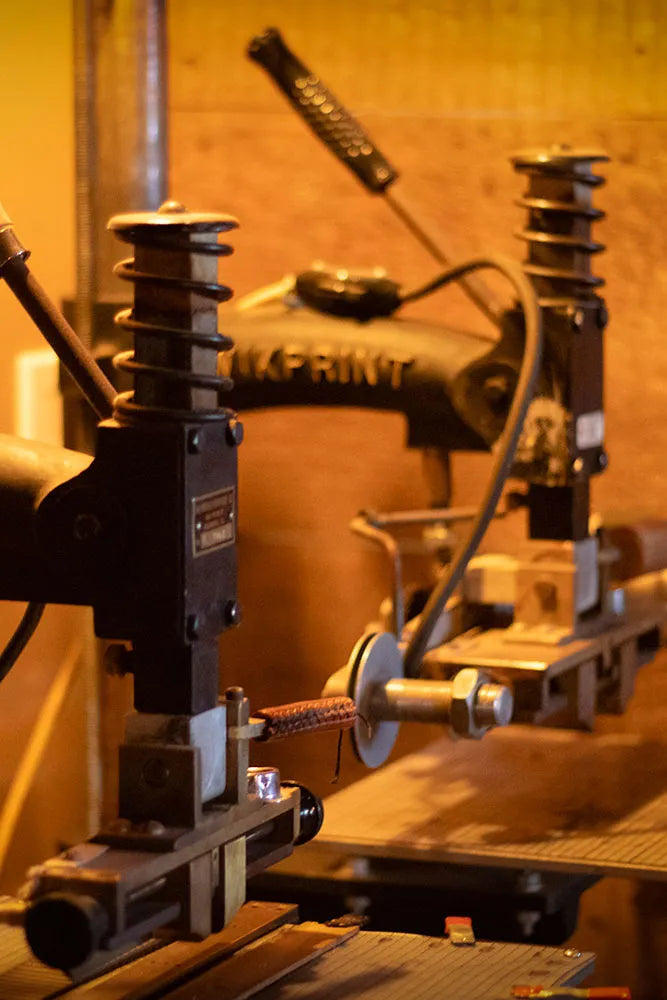 Old fashion embossing equipment for leatherworking in Old Country Leathers workshop